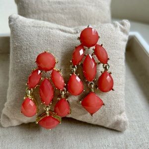 Pink chandelier earrings in gold tone setting in Barbie pink